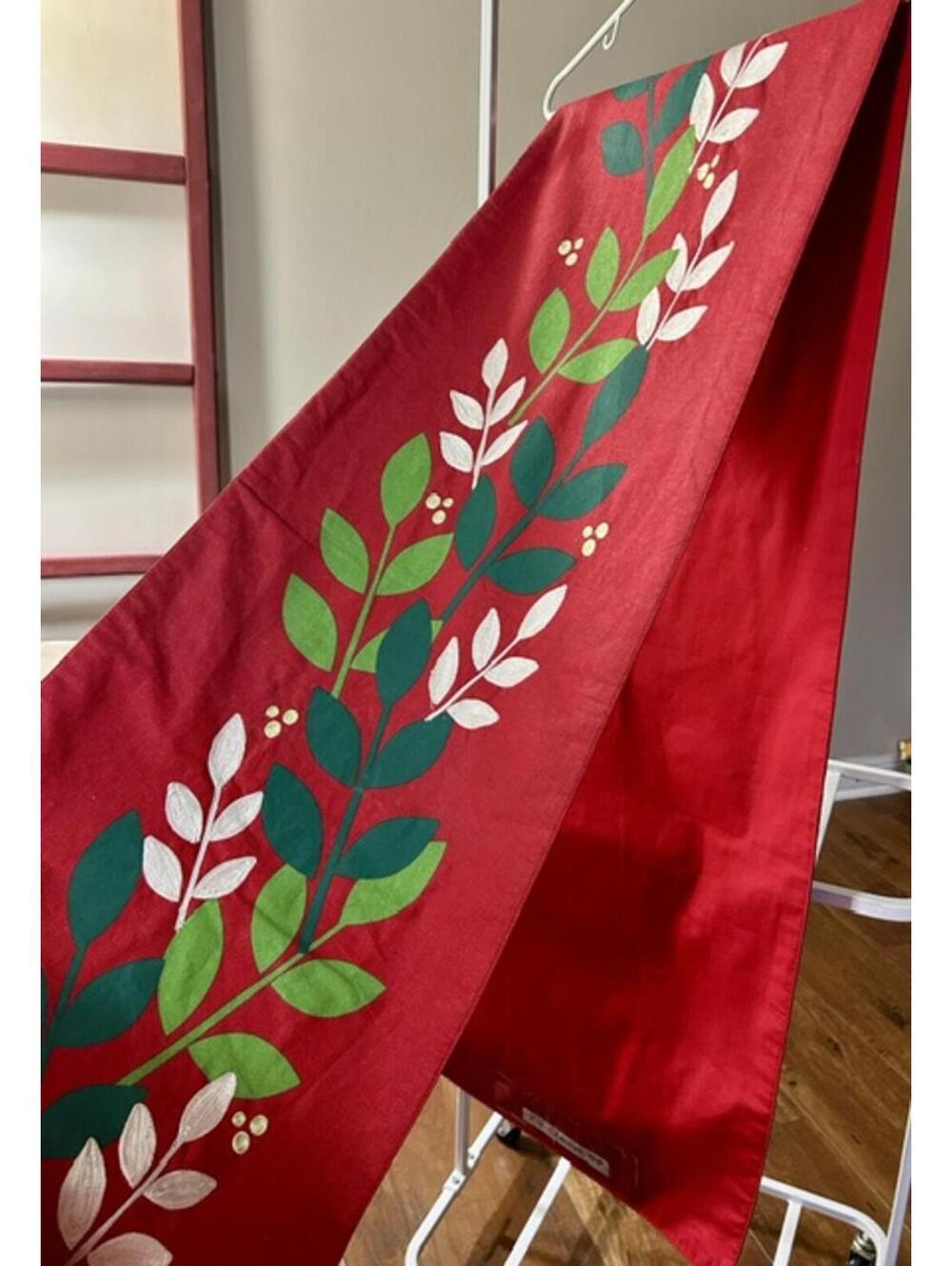 Red Table Runner with Green and White Leaf Pattern